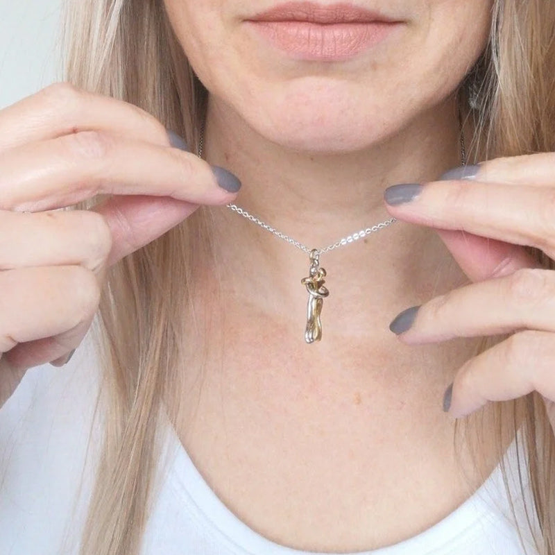 Couple hugging necklace