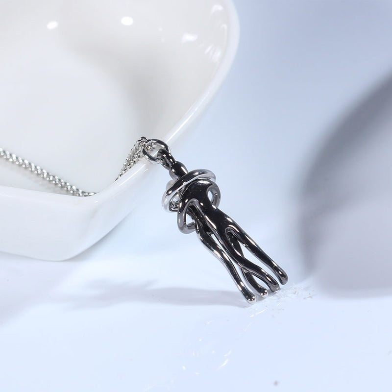 Couple hugging necklace