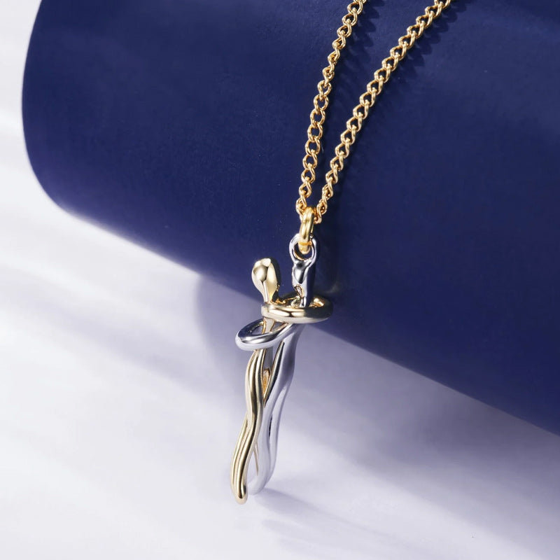 Couple hugging necklace